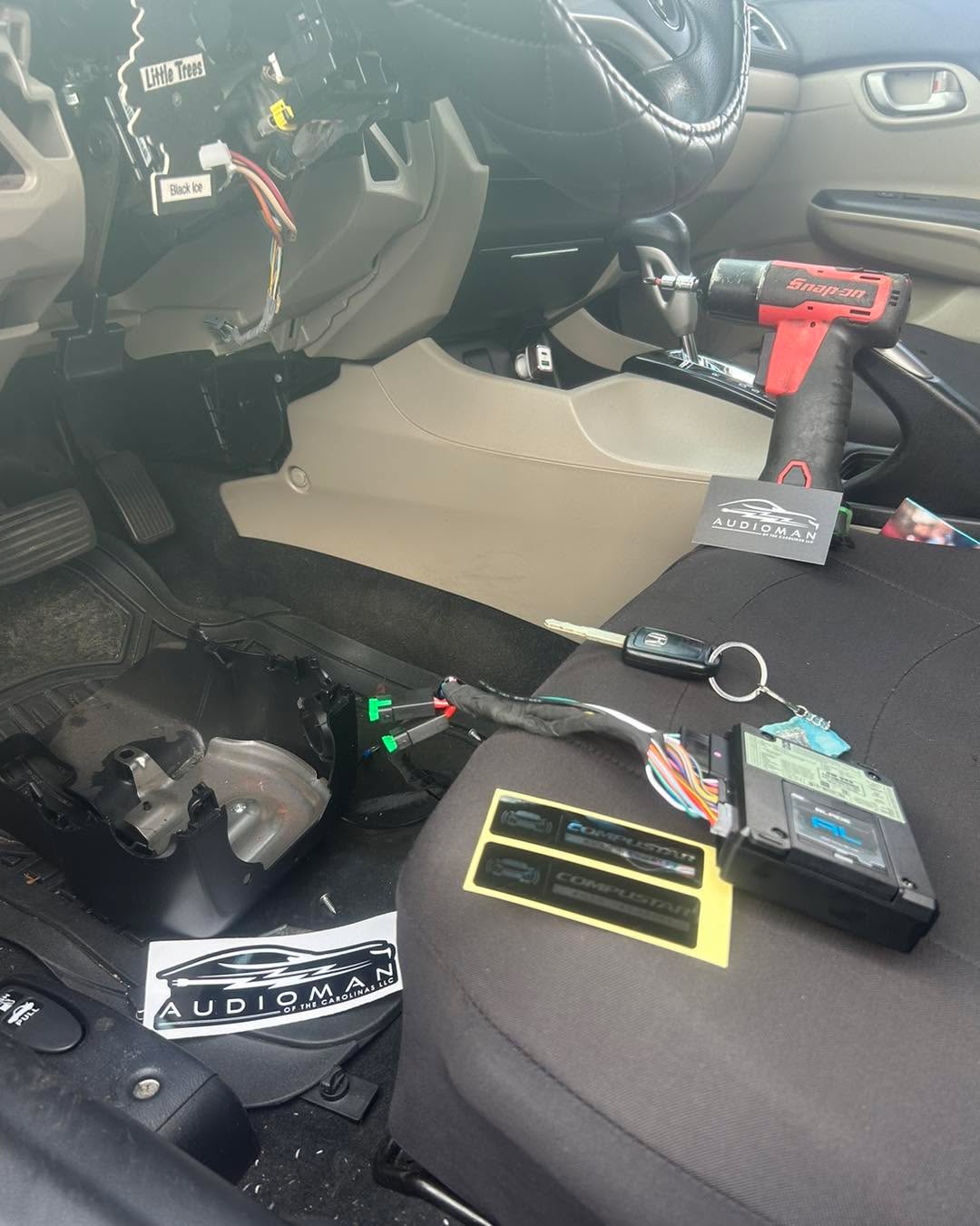 Overhead shot of a vehicle dash during a remote start install